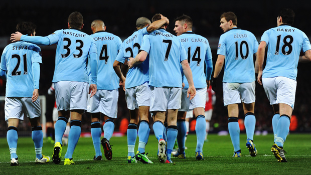 Manchester City players celebrate James Milner's goal against Arsenal